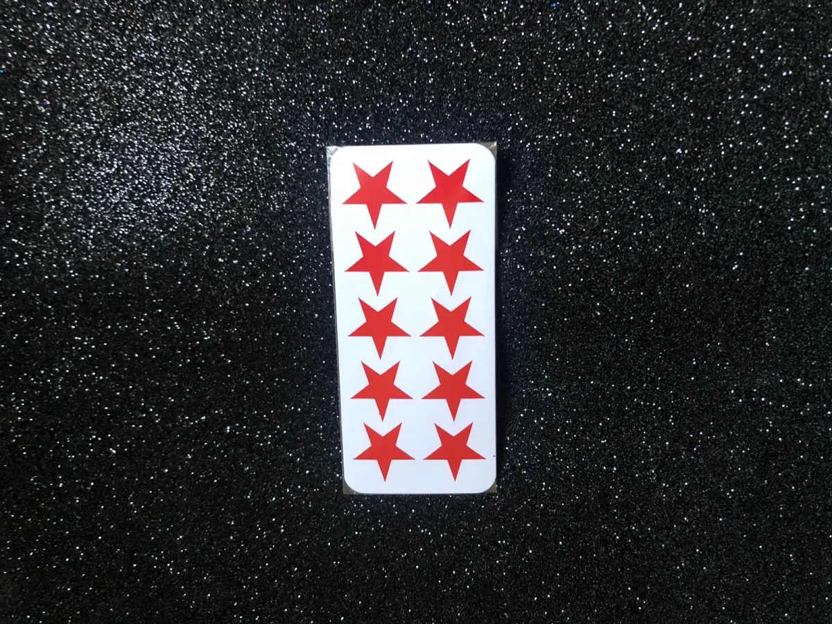 Cartela com 10  adesivos em formato de estrelinha (estrela) Imagem