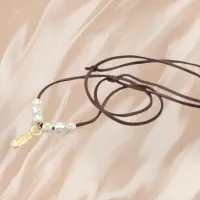 Cordão Marrom com Pingente Aparecida Dourado