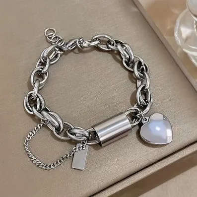 PULSEIRA DE CORRENTE GROSSA EM AÇO INOXIDÁVEL, COM PINGENTE CORAÇÃO, BANHADO A PRATA 925