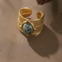 ANEL AJUSTÁVEL EM AÇO INOXIDÁVEL COM PEDRA NATURAL COR VERDE, BANHADO A OURO 18K - Foto 4