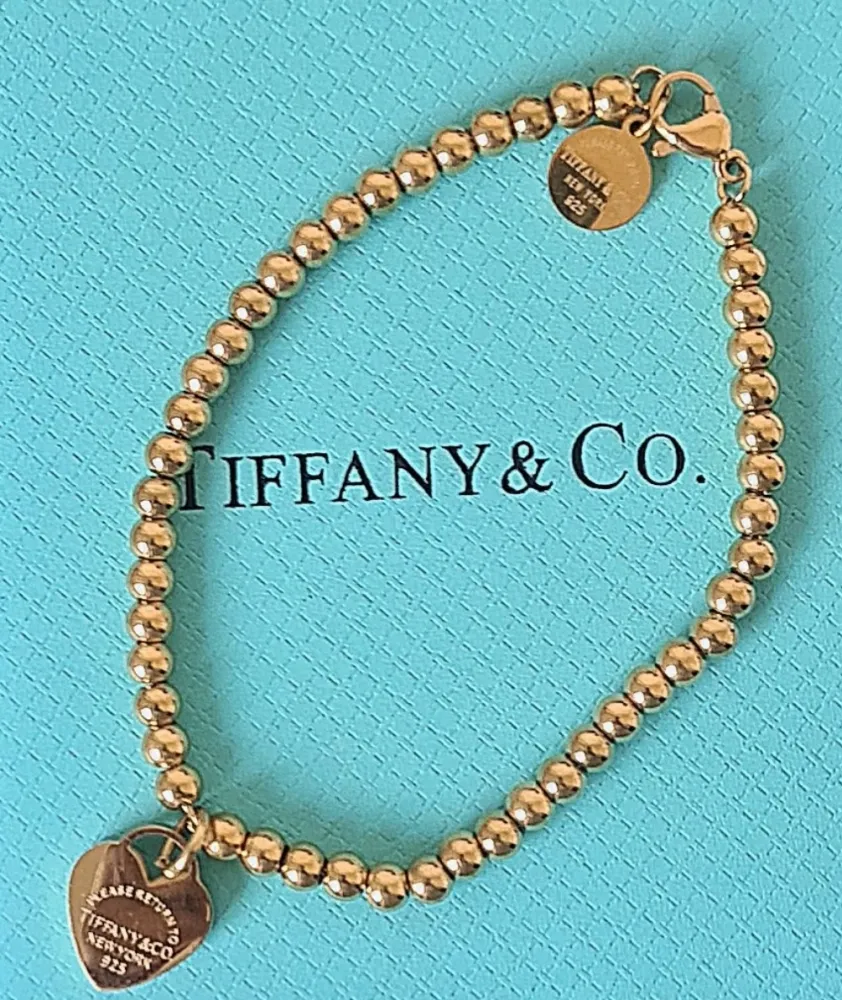 Pulseira de contas Tiffany&Co etiqueta redonda.  Imagem