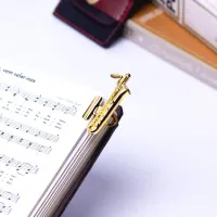 PRENDEDOR DE HINÁRIO / PARTITURA SAX BARÍTONO - Foto 2